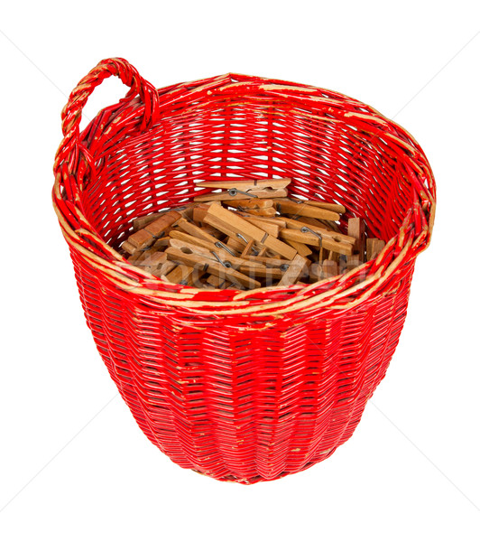 Very old red basket with wooden clothespins Stock photo © michaklootwijk