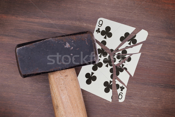 Hammer with a broken card, nine of clubs Stock photo © michaklootwijk