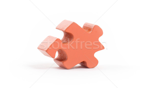 Closeup of big orange jigsaw puzzle piece Stock photo © michaklootwijk