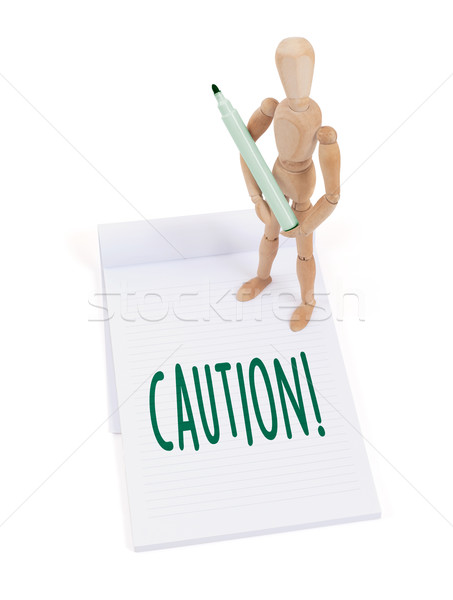 Houten etalagepop schrijven voorzichtigheid plakboek business Stockfoto © michaklootwijk