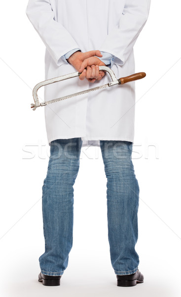 Crazy doctor is holding a big saw in his hands Stock photo © michaklootwijk