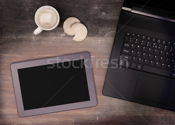 Tablet touch computer gadget on wooden table Stock photo © michaklootwijk