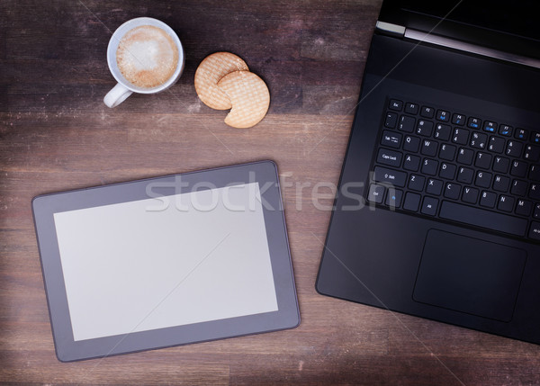 Tablet touch computer gadget on wooden table Stock photo © michaklootwijk