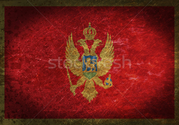 Stock photo: Old rusty metal sign with a flag