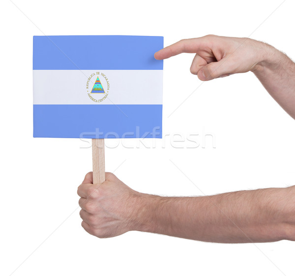 Hand holding small card - Flag of Nicaragua Stock photo © michaklootwijk