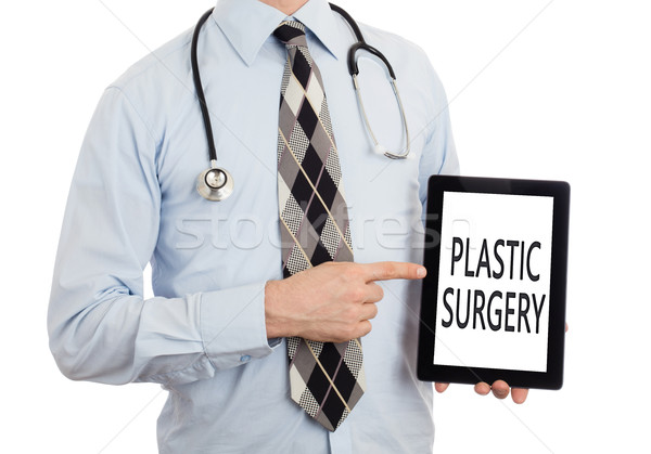 Lekarza tabletka chirurgia plastyczna odizolowany biały Zdjęcia stock © michaklootwijk