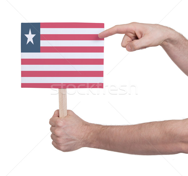 Hand holding small card - Flag of Liberia Stock photo © michaklootwijk