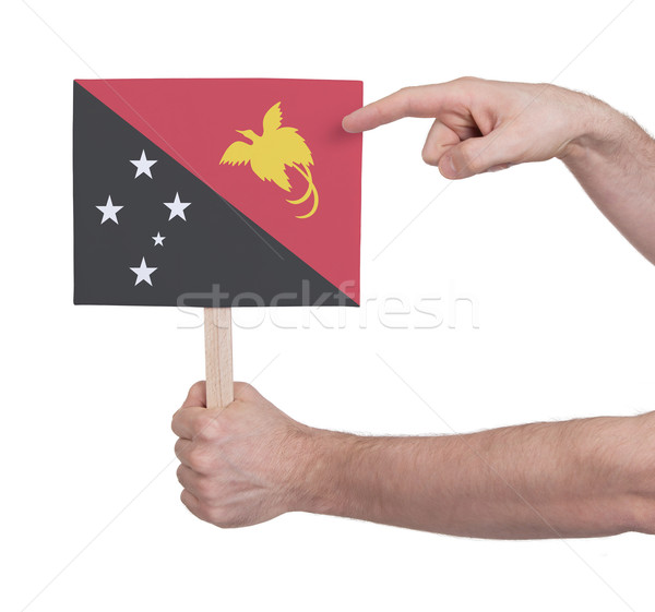 Hand holding small card - Flag of Papua New Guinea Stock photo © michaklootwijk