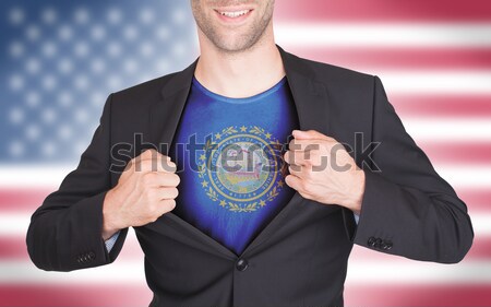 Stock photo: Businessman showing card, matte paper effect