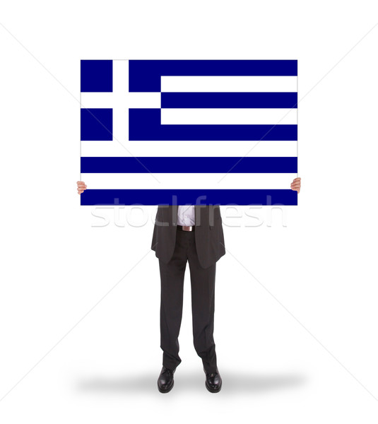 Smiling businessman holding a big card, flag of Greece Stock photo © michaklootwijk