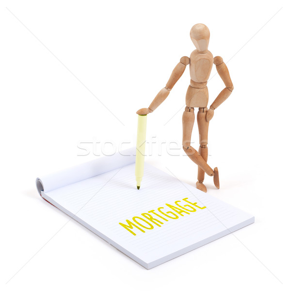 Wooden mannequin writing - Mortgage Stock photo © michaklootwijk