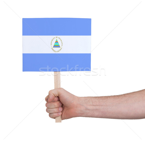 Hand holding small card - Flag of Nicaragua Stock photo © michaklootwijk