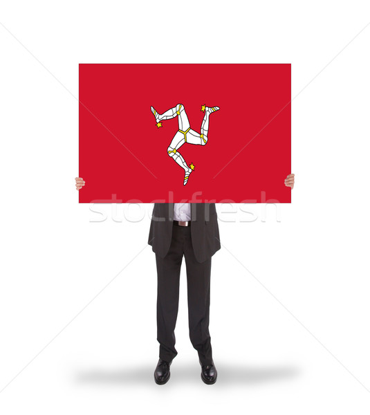 Smiling businessman holding a big card, flag of Isle of Man Stock photo © michaklootwijk