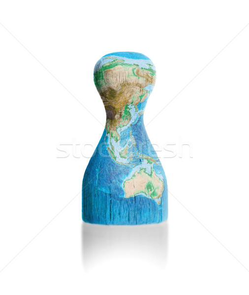 Wooden pawn with a painting of a map Stock photo © michaklootwijk