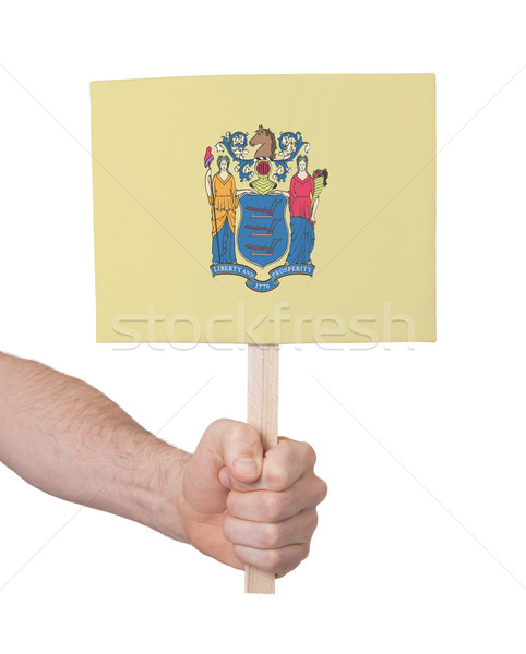 Hand holding small card - Flag of New Jersey Stock photo © michaklootwijk
