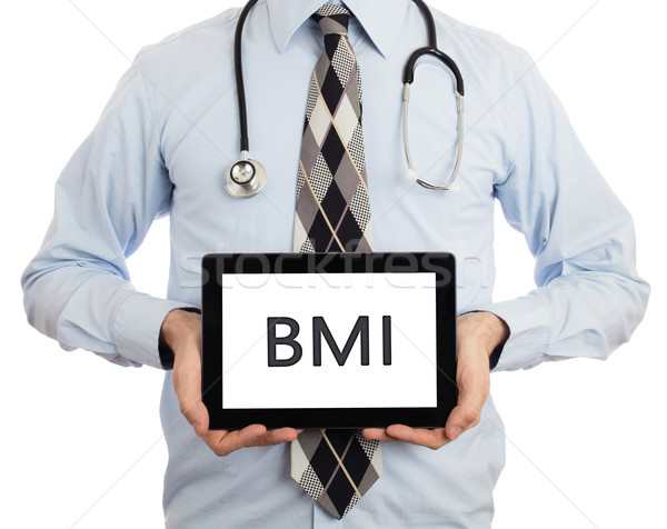 Stock photo: Doctor holding tablet - BMI