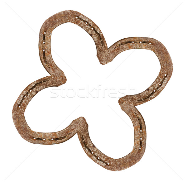 Stock photo: Horseshoes forming a clover leaf