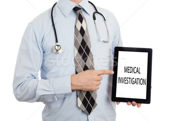Arzt halten Tablet medizinischen Untersuchung isoliert Stock foto © michaklootwijk