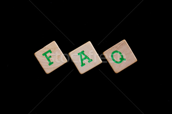 Green letters on old wooden blocks (FAQ) Stock photo © michaklootwijk