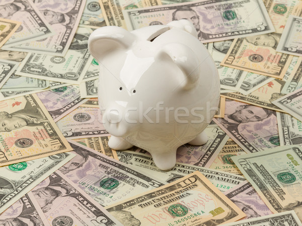 Piggy bank on dollar bills Stock photo © michaklootwijk