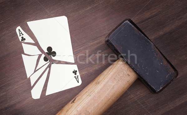 Hammer with a broken card, ace of clubs Stock photo © michaklootwijk