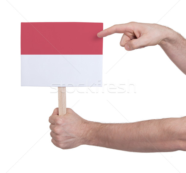 Hand holding small card - Flag of Indonesia Stock photo © michaklootwijk