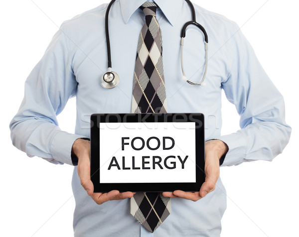Doctor holding tablet - Food allergy Stock photo © michaklootwijk