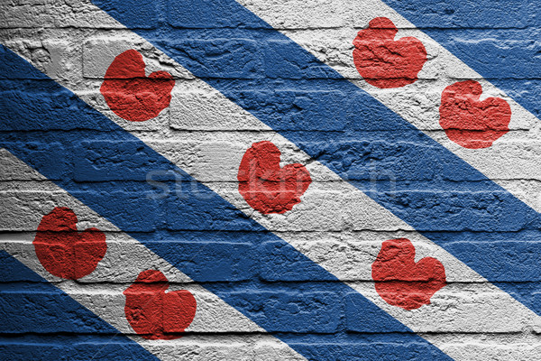 Brick wall with a painting of a flag, Friesland Stock photo © michaklootwijk