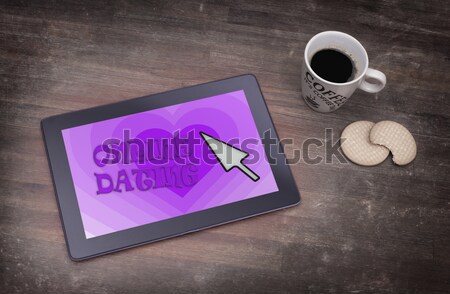 Tablet with Wi-Fi connection on a wooden desk Stock photo © michaklootwijk