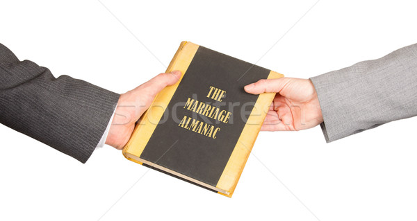 Man and woman holding a marriage almanac Stock photo © michaklootwijk