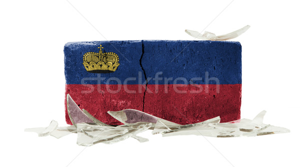 Cegły stłuczone szkło przemocy banderą Liechtenstein ściany Zdjęcia stock © michaklootwijk
