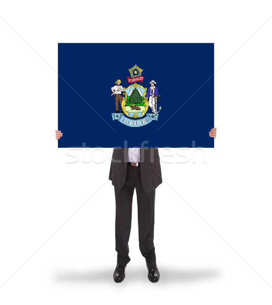 Smiling businessman holding a big card, flag of Maine Stock photo © michaklootwijk