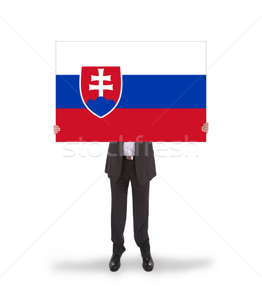 Businessman holding a big card, flag of Slovakia Stock photo © michaklootwijk