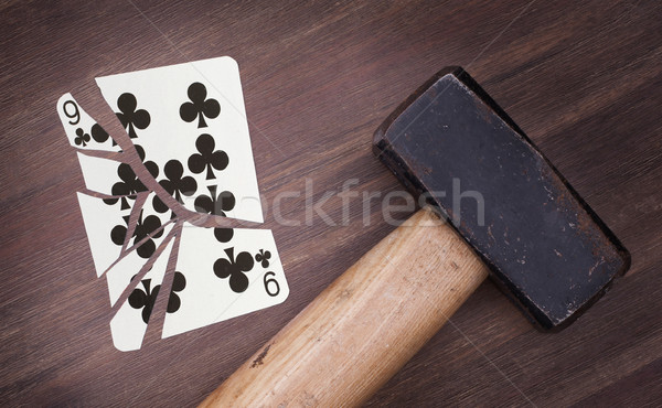 Hammer with a broken card, nine of clubs Stock photo © michaklootwijk