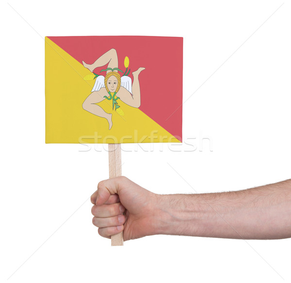 Hand holding small card - Flag of Sicily Stock photo © michaklootwijk