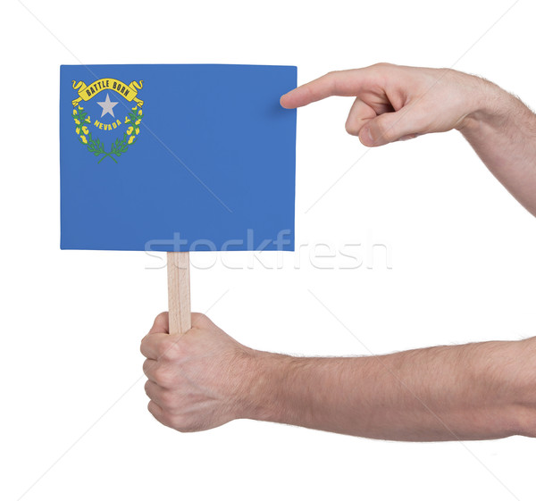 Hand holding small card - Flag of Nevada Stock photo © michaklootwijk