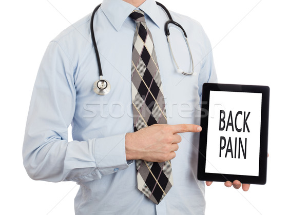 Doctor holding tablet - Back pain Stock photo © michaklootwijk
