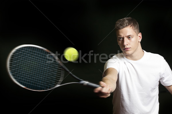 Young man playing tennis Stock photo © mikdam