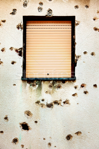 Bullet holes in a house facade Stock photo © mikdam