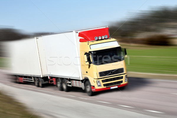 truck driving on country-road/motion Stock photo © mikdam