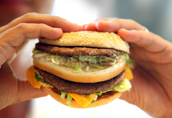 man's hands, holding onto a burger Stock photo © mikdam