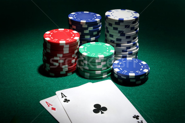 Two aces and stack of Casino Chips in background Stock photo © mikdam