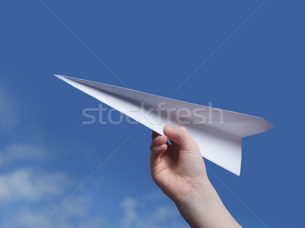 throwing a paper plane..  Stock photo © mikdam