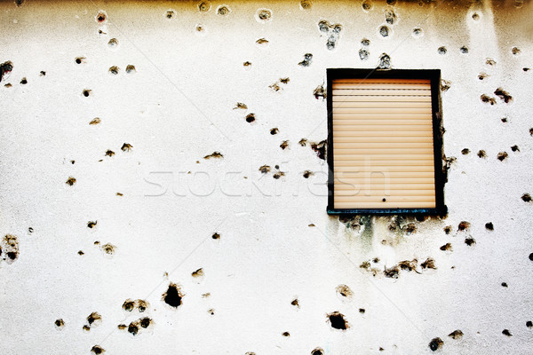 Bullet holes in a house facade Stock photo © mikdam