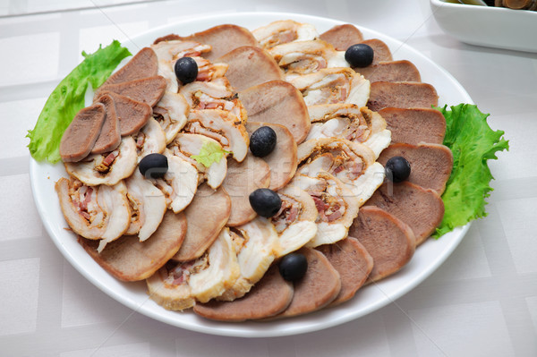 Appetizing meat slices is spread out to plate Stock photo © mikhail_ulyannik