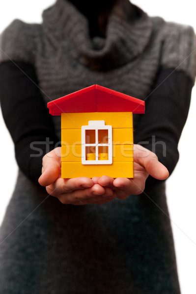 woman holding toy house in a hands on white backgrounds Stock photo © mikhail_ulyannik