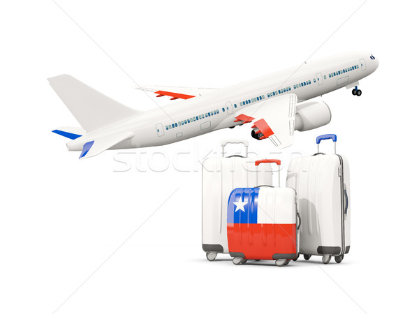 Luggage with flag of chile. Three bags with airplane Stock photo © MikhailMishchenko