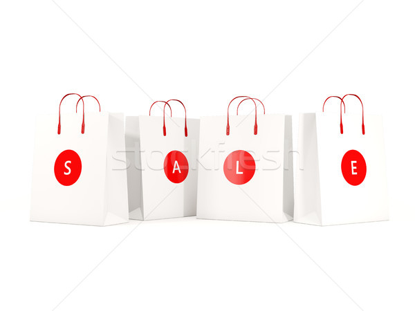 Sale and shopping concept. Paper shopping bags isolated on white Stock photo © MikhailMishchenko