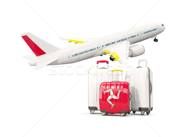 Luggage with flag of isle of man. Three bags with airplane Stock photo © MikhailMishchenko