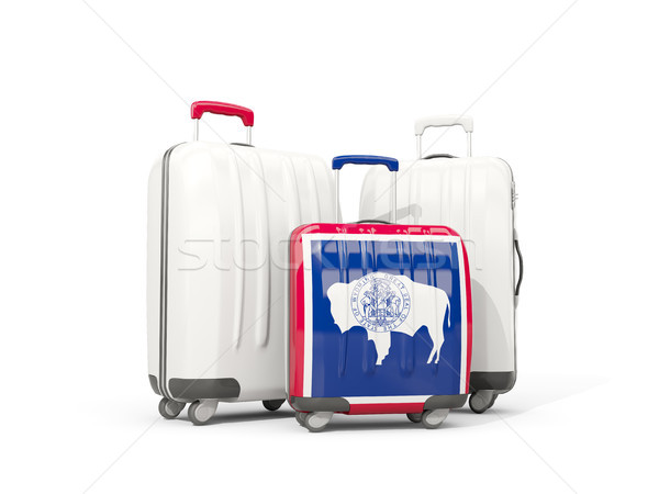 Luggage with flag of wyoming. Three bags with united states loca Stock photo © MikhailMishchenko